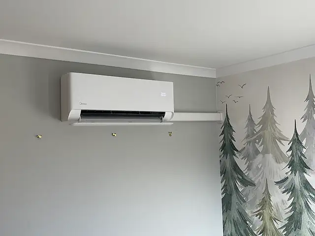 Domestic air conditioning in Canary Wharf A slim wall-mounted air conditioner with neat trunking, the kind of air conditioning we fit for homes in Canary Wharf