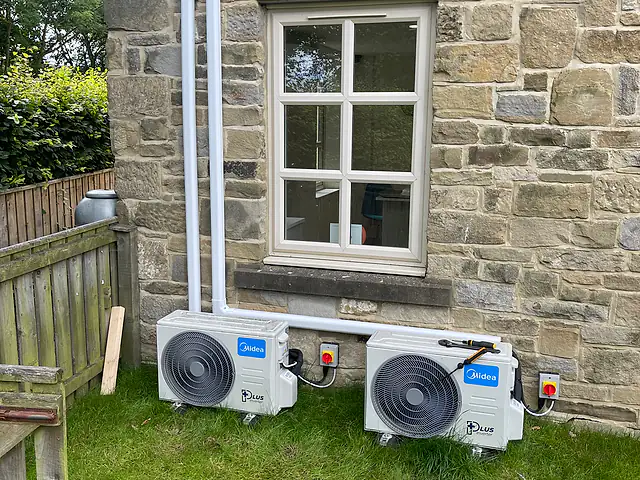 Multi-Split Air Conditioning in London Multi-Split Air Conditioning in London: two outdoor air conditioning units beside a stone-built house