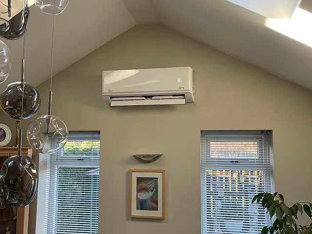 Domestic Air Conditioning in London Domestic Air Conditioning in London: a wall-mounted split unit on the gable wall of a vaulted living room